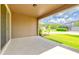 Covered patio perfect for outdoor entertaining with views of the lush lawn at 2280 Long Spur, Odessa, FL 33556