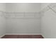 A walk-in closet with white wire shelving provides ample storage space at 2280 Long Spur, Odessa, FL 33556