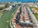 Waterfront condo community with canal access, featuring a pool and sports complex nearby at 230 Medallion Blvd # F, Madeira Beach, FL 33708