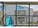 Screened in balcony with seating and view of a building at 230 Medallion Blvd # F, Madeira Beach, FL 33708