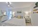 Inviting bedroom with natural light, stylish decor, and spacious layout at 230 Medallion Blvd # F, Madeira Beach, FL 33708