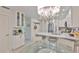 Eat-in kitchen with quartz countertops, stainless steel appliances, and charming breakfast nook at 230 Medallion Blvd # F, Madeira Beach, FL 33708
