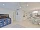 Open concept living area with adjacent eat-in kitchen and modern lighting at 230 Medallion Blvd # F, Madeira Beach, FL 33708