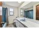 Bathroom with countertop and a large mirror at 2410 Covington Ave, Spring Hill, FL 34608