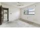 Bedroom has natural light from windows, great closet space, and door at 2410 Covington Ave, Spring Hill, FL 34608