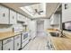 Charming kitchen featuring a skylight, neutral countertops, and essential appliances at 2410 Covington Ave, Spring Hill, FL 34608
