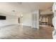 Bright and spacious living room with wood-look floors and slider doors leading to outdoor living space at 2410 Covington Ave, Spring Hill, FL 34608