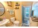 Bathroom with a single sink, toilet, and a shower with a curtain and direct access to the backyard at 2417 Valrico Forest Dr, Valrico, FL 33594