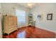 Bedroom with hardwood floors, decorative furniture, and a ceiling fan at 2417 Valrico Forest Dr, Valrico, FL 33594