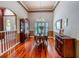Formal dining room featuring hardwood floors, elegant lighting, and detailed trim at 2417 Valrico Forest Dr, Valrico, FL 33594