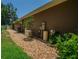 Exterior of house with landscaping, generator, and utilities along the side at 2417 Valrico Forest Dr, Valrico, FL 33594