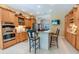 Open-concept kitchen with a granite island, stainless appliances, and ample cabinetry at 2417 Valrico Forest Dr, Valrico, FL 33594
