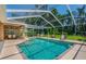 Enjoy the Florida lifestyle with this screened in pool and lounging area at 2417 Valrico Forest Dr, Valrico, FL 33594