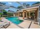 Relaxing screened-in pool area with plenty of space for outdoor entertaining and lounging at 2417 Valrico Forest Dr, Valrico, FL 33594