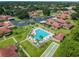 Aerial view of community featuring a pool, shuffleboard courts, and carports at 2444 Laurelwood Dr # A, Clearwater, FL 33763