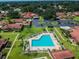 An aerial view of the community, highlighting the pool and surrounding properties at 2444 Laurelwood Dr # A, Clearwater, FL 33763