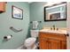 Cozy bathroom features stylish vanity, mirror, and toilet at 2444 Laurelwood Dr # A, Clearwater, FL 33763