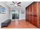 Bedroom featuring a built-in wall unit with sliding glass doors leading to the outdoor area at 2444 Laurelwood Dr # A, Clearwater, FL 33763