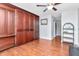 Spacious bedroom featuring a built-in wall unit and laminate flooring at 2444 Laurelwood Dr # A, Clearwater, FL 33763