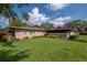 Home exterior with well-manicured lawn and attractive landscaping at 2444 Laurelwood Dr # A, Clearwater, FL 33763