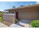 Exterior view of a well-maintained home with a red front door, landscaping, and clear signage at 2444 Laurelwood Dr # A, Clearwater, FL 33763