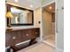 Hallway with tiled floor, stylish furniture, mirror, and access to shower at 2444 Laurelwood Dr # A, Clearwater, FL 33763