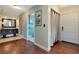 Hallway offers wood look flooring, hallway closet, and access to bathroom at 2444 Laurelwood Dr # A, Clearwater, FL 33763