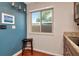 Kitchen featuring wood cabinets, granite countertops, and stainless steel appliances, bathed in natural light at 2444 Laurelwood Dr # A, Clearwater, FL 33763
