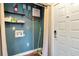 Functional laundry area featuring essential hookups and convenient shelving for storage at 2444 Laurelwood Dr # A, Clearwater, FL 33763