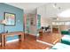Spacious living room with stylish furnishings, mirrored wall, and plenty of natural light at 2444 Laurelwood Dr # A, Clearwater, FL 33763