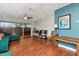 Inviting living room featuring hardwood floors, slider to lanai, ceiling fan, and stylish decor at 2444 Laurelwood Dr # A, Clearwater, FL 33763