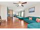 Open living room boasting wood-look flooring and a mirrored wall at 2444 Laurelwood Dr # A, Clearwater, FL 33763