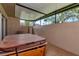 Covered patio with a hot tub, perfect for relaxation and outdoor enjoyment at 2444 Laurelwood Dr # A, Clearwater, FL 33763