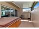 Screened in patio featuring a hot tub, seating and views of the backyard at 2444 Laurelwood Dr # A, Clearwater, FL 33763