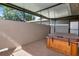 Covered patio featuring a hot tub, perfect for relaxation and outdoor enjoyment at 2444 Laurelwood Dr # A, Clearwater, FL 33763