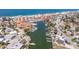Aerial view showcases this waterfront home, beach, and nearby marina creating the perfect coastal lifestyle at 253 Boca Ciega Dr, Madeira Beach, FL 33708