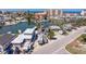 Aerial view of the property showcasing the home, waterway, and surrounding area at 253 Boca Ciega Dr, Madeira Beach, FL 33708