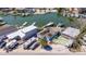 Bird's eye view of the property with nearby canal and boat docks at 253 Boca Ciega Dr, Madeira Beach, FL 33708