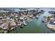 Waterfront home with multiple docks and boat lifts provides direct access to the Gulf of Mexico at 253 Boca Ciega Dr, Madeira Beach, FL 33708