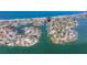 Beautiful aerial showcasing the waterfront home located near the stunning beach and coastal neighborhood at 253 Boca Ciega Dr, Madeira Beach, FL 33708