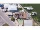 Aerial view of a waterfront property with boat docks, RV and car parking, and proximity to other residential homes at 253 Boca Ciega Dr, Madeira Beach, FL 33708