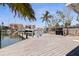 Home's private dock with direct access to the Gulf of Mexico has a boat lift at 253 Boca Ciega Dr, Madeira Beach, FL 33708
