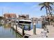 Home's private dock with direct access to the Gulf of Mexico and boat lift at 253 Boca Ciega Dr, Madeira Beach, FL 33708