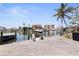 Home's private dock with direct access to the Gulf of Mexico offers a boat lift at 253 Boca Ciega Dr, Madeira Beach, FL 33708