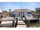 Waterfront home with large wooden deck, boat dock with direct access to the Gulf of Mexico at 253 Boca Ciega Dr, Madeira Beach, FL 33708