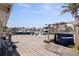 Home's large wooden deck with direct access to the Gulf of Mexico and community at 253 Boca Ciega Dr, Madeira Beach, FL 33708