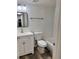 Modern bathroom features new fixtures, a vanity, and updated tiling in shower/tub combo at 2690 Coral Landings Blvd # 217, Palm Harbor, FL 34684