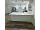 Bright kitchen featuring stainless appliances, stylish pendant lighting, and ample counter space at 2690 Coral Landings Blvd # 217, Palm Harbor, FL 34684