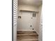 Functional laundry closet features shelving and a utility hookup, maximizing space and convenience at 2690 Coral Landings Blvd # 217, Palm Harbor, FL 34684