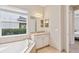 Elegant bathroom with a soaking tub and lots of natural light at 30764 Lindentree Dr, Wesley Chapel, FL 33543